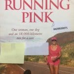 Cover of Pink Running, showing Deborah De Williams and her dog running along an Australian country road.