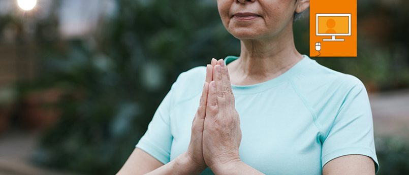 woman with hands in yoga prayer position