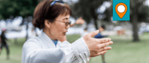 woman practicing Tai chi in park