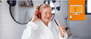 woman in robe wearing headphones and singing into hairbrush