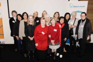 A group of past and present Counterpart volunteers at a 20th anniversary celebration.