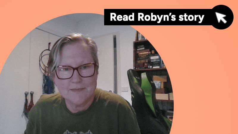 Read Robyn's story. With a photo of Robyn sitting at her computer.