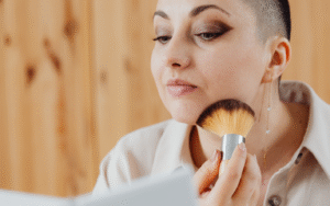 woman applying powder with a brush